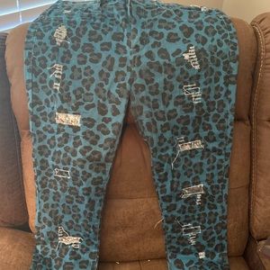Distressed leopard print jeans